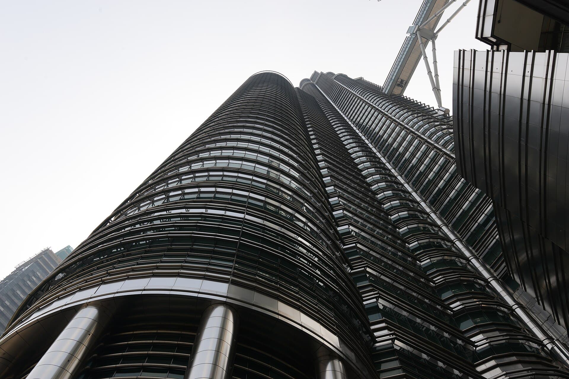 Tiered steel and glass tower rising into the sky
